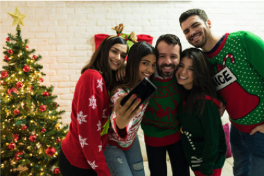 A group of people standing in front of a crowd posing for the camera

Description automatically generated